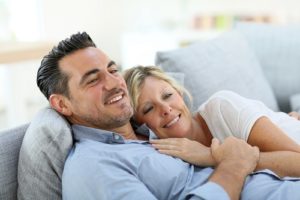 attractive couple lounging in couch