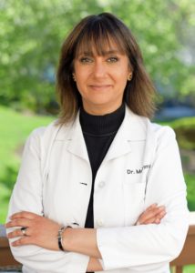 Sunita in lab coat